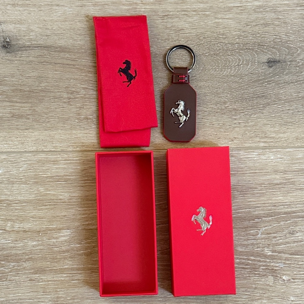NEW, Never used Ferrari Brown Leather Keychain with Red Pouch and box